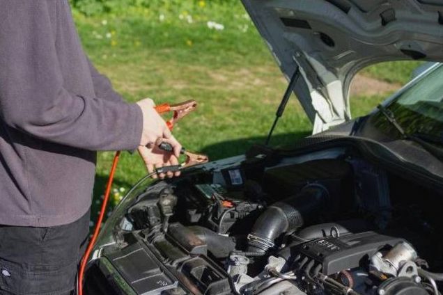 Technician scanning vehicle OBD port